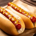 Hot,Dogs,With,Ketchup,,Yellow,Mustard,,Fries,And,Soda.,Image