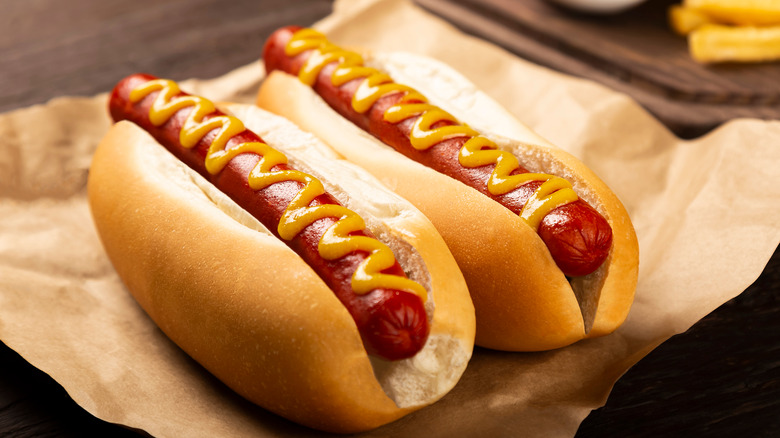 Hot,Dogs,With,Ketchup,,Yellow,Mustard,,Fries,And,Soda.,Image